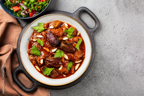 Принти на полотні Traditional Moroccan lamb tagine simmered in spices, with dates and almonds