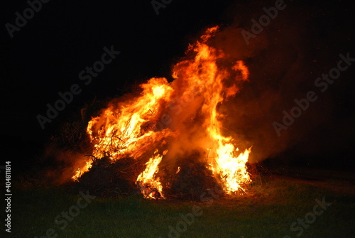 Large bonfire, burning and glowing with soft flames