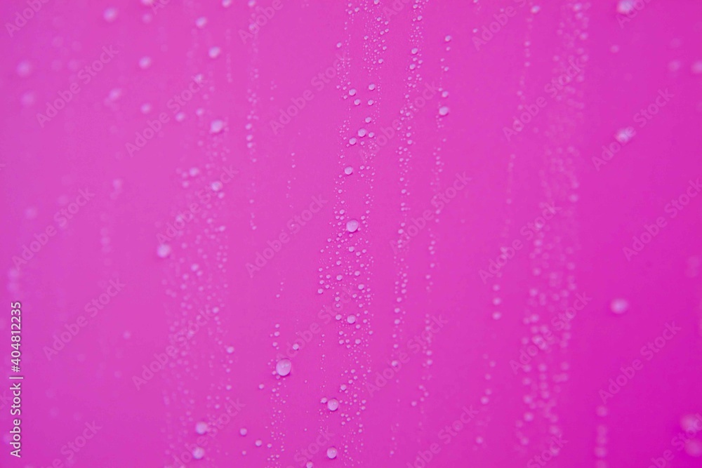 Full frame of the textures formed by the bubbles and drops of water. Drops of water spilled on a light pink surface Full frame of the textures formed by the bubbles and drops of water. Drops of water spilled on a light pink surface