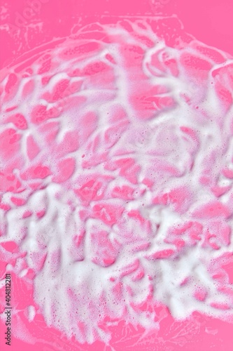 Fototapeta Naklejka Na Ścianę i Meble -  Washing concept. Soap foam on delicate pink background with copy space