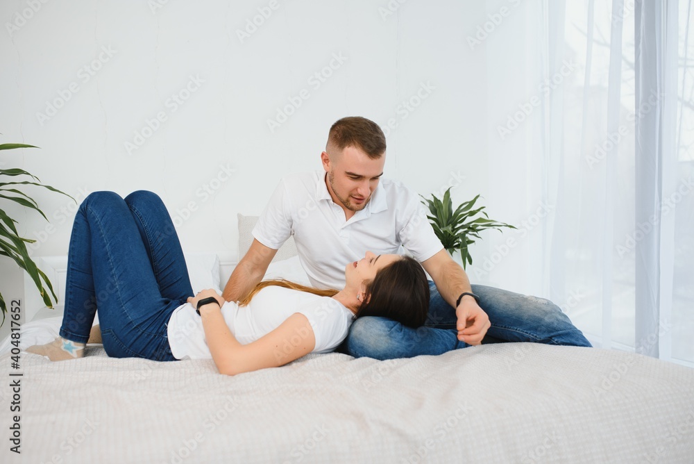 Pretty couple hugging in the bed. Pretty couple hugging in the bed.