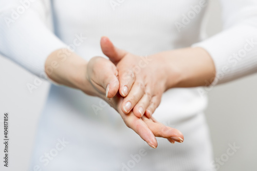 rub hands with alcohol disinfection photo