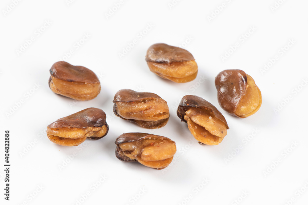 fava bean, roasted and salty on white background