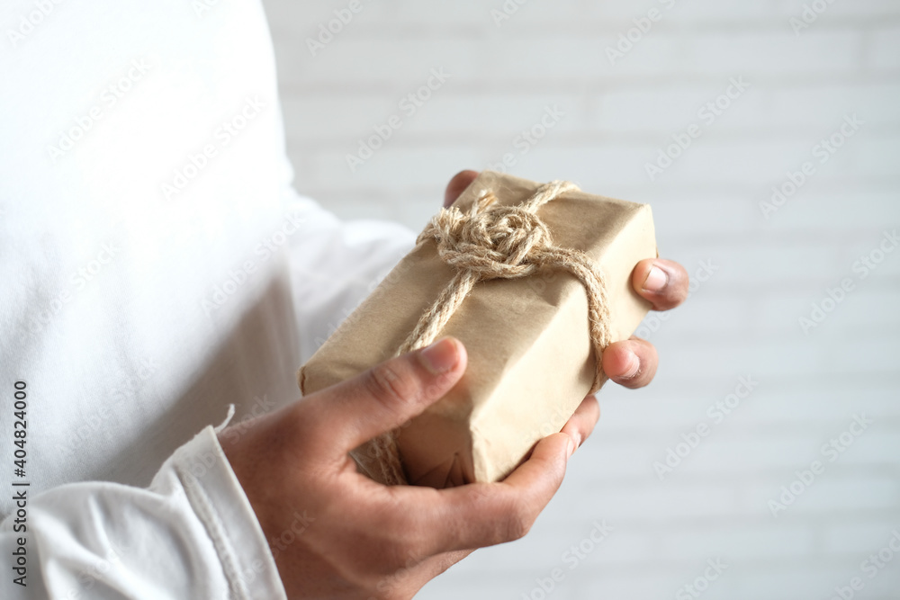 man hand holding gift box with copy space 