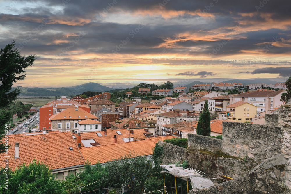 view of medieval city in Spain with colorful sky