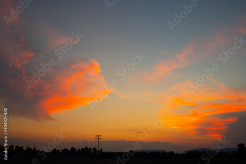 Orange cloudy sunset at the city © KyriaKos Kinatidis