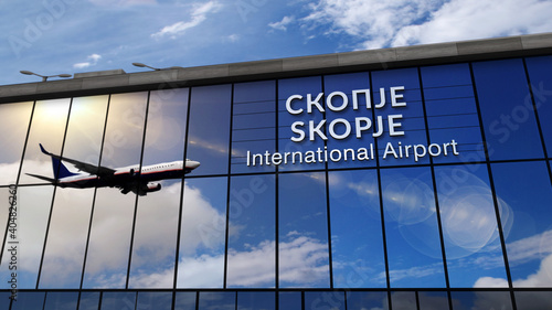 Airplane landing at Skopje North Macedonia airport mirrored in terminal