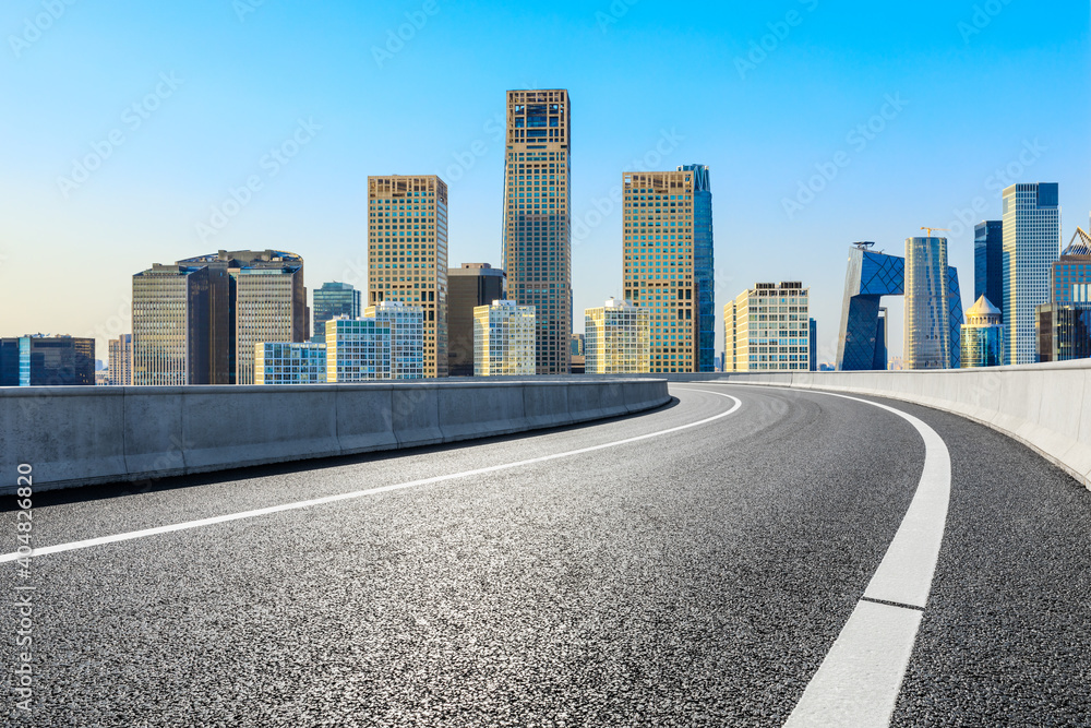 Asphalt road and modern city commercial buildings in Beijing,China.