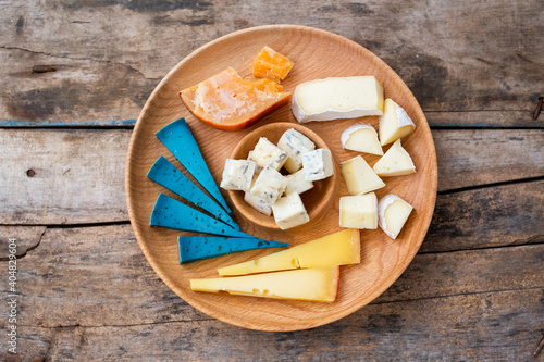 Top view of set cheese board on wooden background