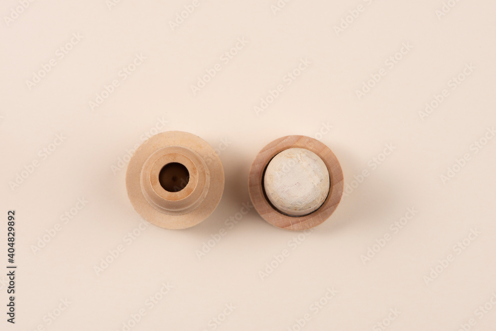Two different bottle stoppers. One is natural, the other is plastic. Top view. The concept of alternative. Two different bottle stoppers. One is natural, the other is plastic. Top view. The concept of alternative.