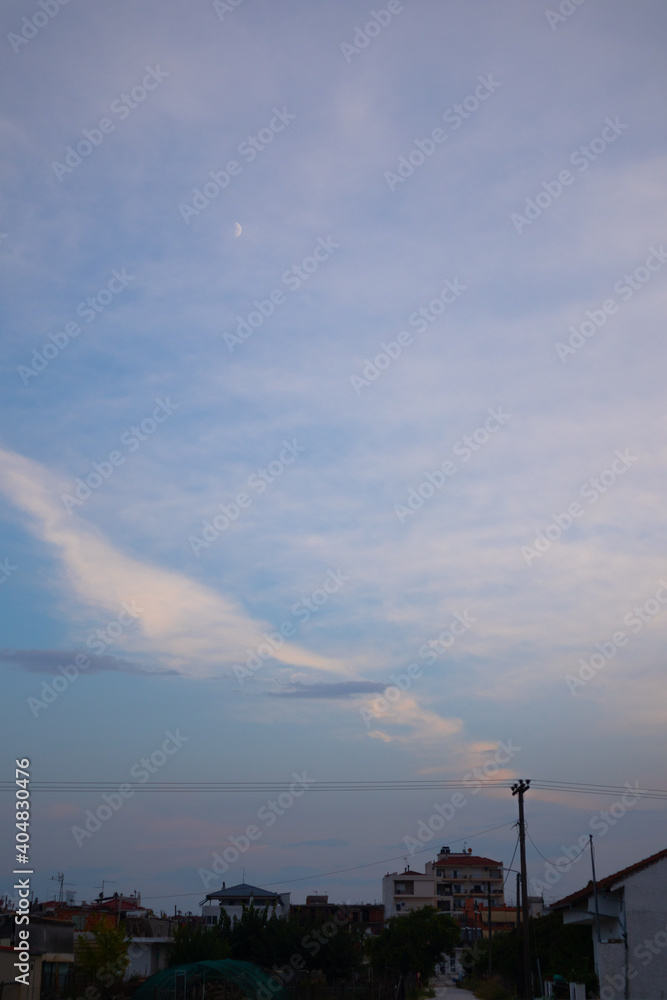 Colorful cloudy sunset at the city