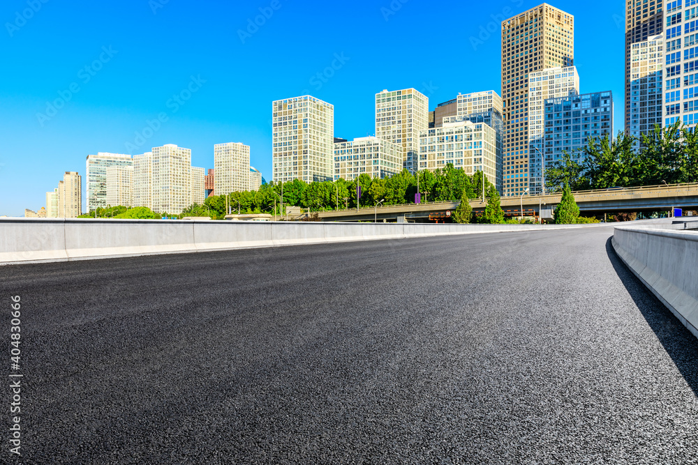 Asphalt road and modern city commercial buildings in Beijing,China. Asphalt road and modern city commercial buildings in Beijing,China.