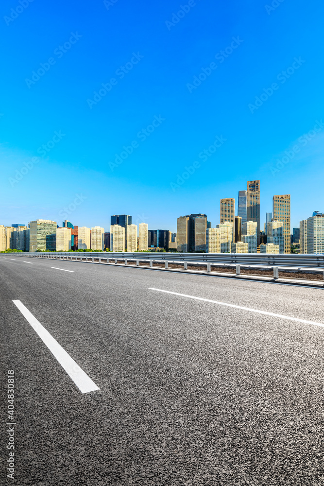 Asphalt road and modern city commercial buildings in Beijing,China. Asphalt road and modern city commercial buildings in Beijing,China.