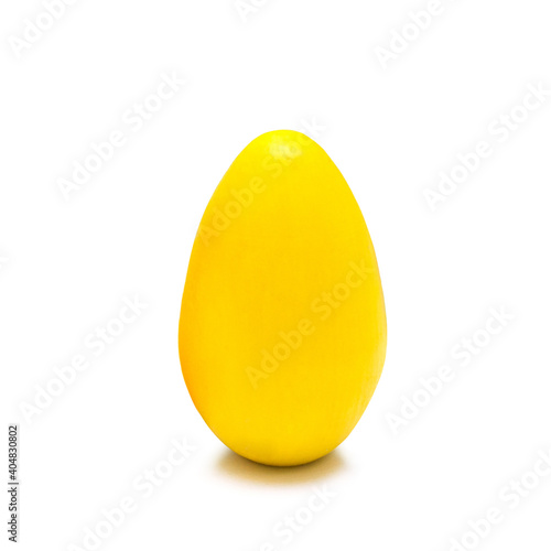 Yellow Easter egg on a white background. Close-up, isolate.