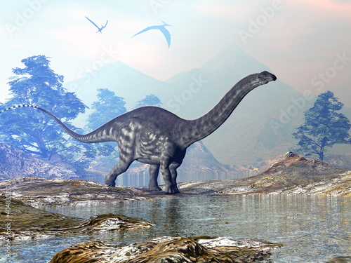 Apatosaurus dinosaur walking in a beautiful landscape with mountains and water by sunset - 3D render © Elenarts