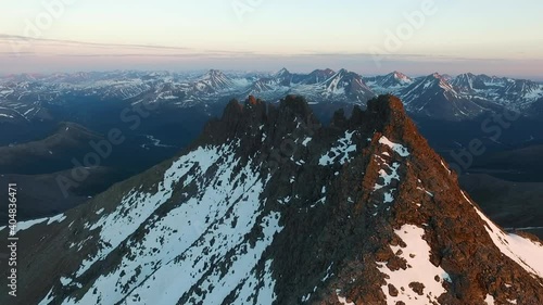 Mountains at dawn. Drone video. Flight near the mountain. Pripolar Ural Mountains. Manaraga photo