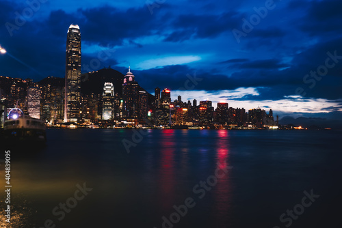 Illuminated megapolis near water in night time