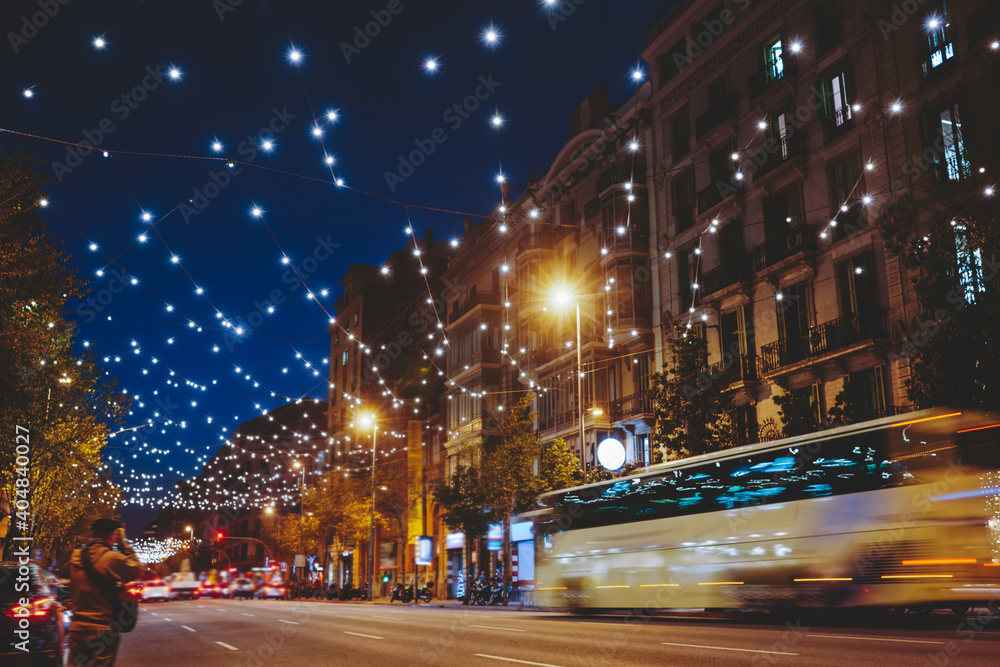Shiny busy city street at night