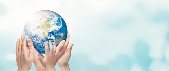 Earth globe in family hands. World environment day