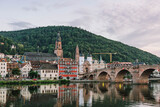 Heidelberg old bridge over Neckar river after sunset in summer
