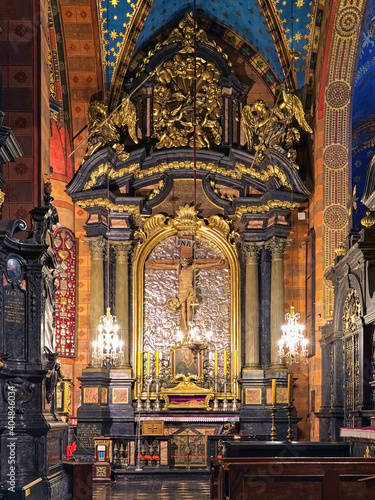 Krakow, Poland. Baroque altar of the Holy Cross in the southern nave of St. Mary's Basilica with Crucifix of Veit Stoss. The crucifix was created in 1496 by the German sculptor Veit Stoss.