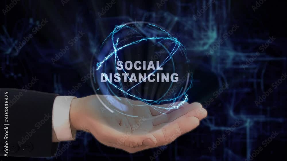 Painted hand shows concept text Social Distancing hologram on his hand. Drawn man in business suit with future technology screen and modern cosmic background Painted hand shows concept text Social Distancing hologram on his hand. Drawn man in business suit with future technology screen and modern cosmic background