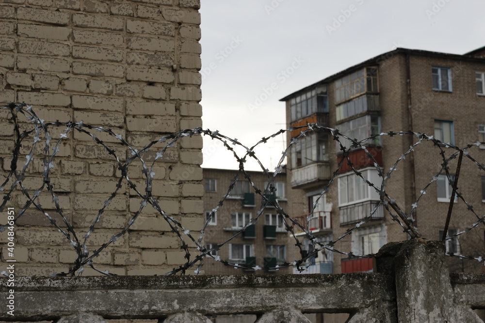 high-rise buildings fenced with barbed wire high-rise buildings fenced with barbed wire