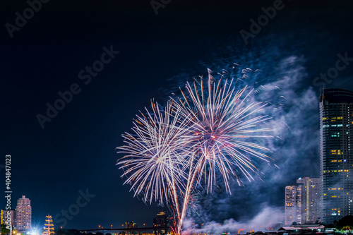Firework display for celebration happy new year and merry christmas with Twilight night and firework lighting in bangkok cityscape, Thailand. © lukyeee_nuttawut