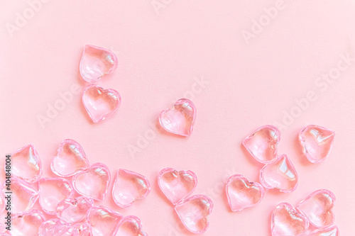 St. Valentine's Day concept. Many pink hearts isolated on pink pastel background. Postcard banner on valentines day. Love date lovesick wedding romance symbol. Top view flat lay, copy space