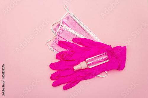Fashion masks glamour gloves and sanitizer isolated on pink background