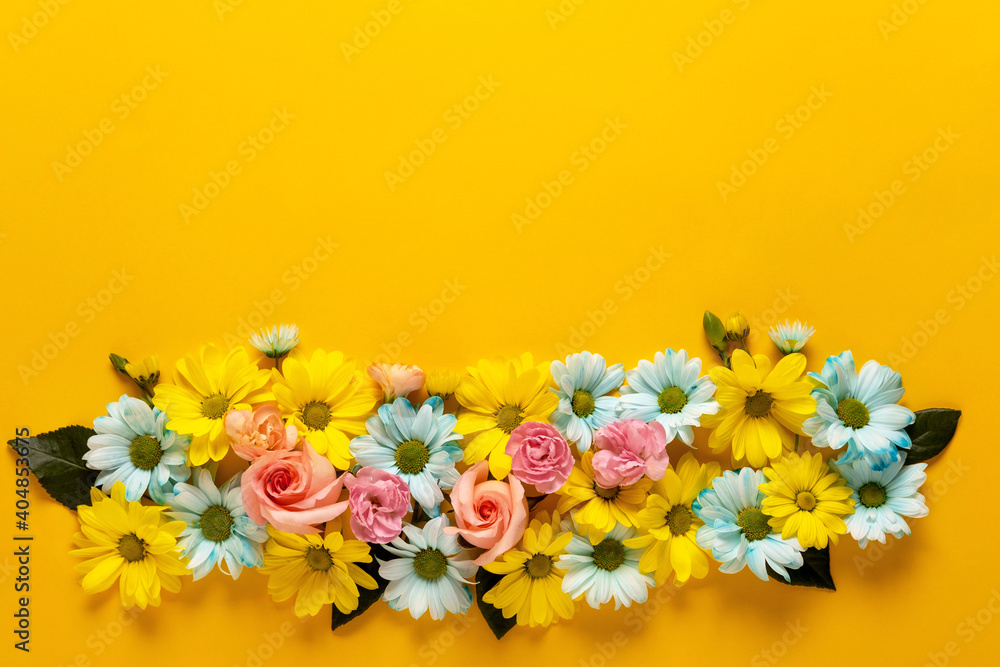 Spring blossom. Floral wreath on yellow background. For easter and spring greeting cards with copy space. Springtime. Flat lay, top view.