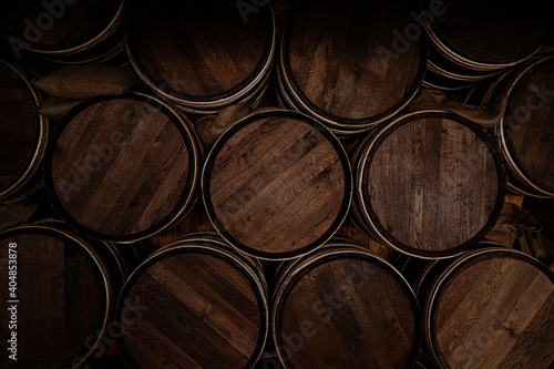stack of wooden wine barrels