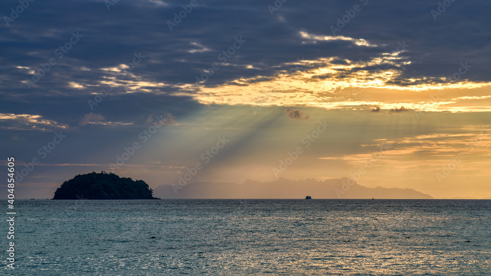 Landscape of oceam seascape with sunrise skyline and sun-rays beam from cloud