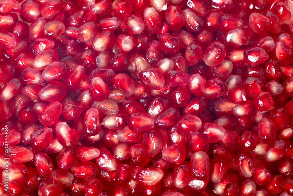 Textured red ripe juicy pomegranate seed background Textured red ripe juicy pomegranate seed background