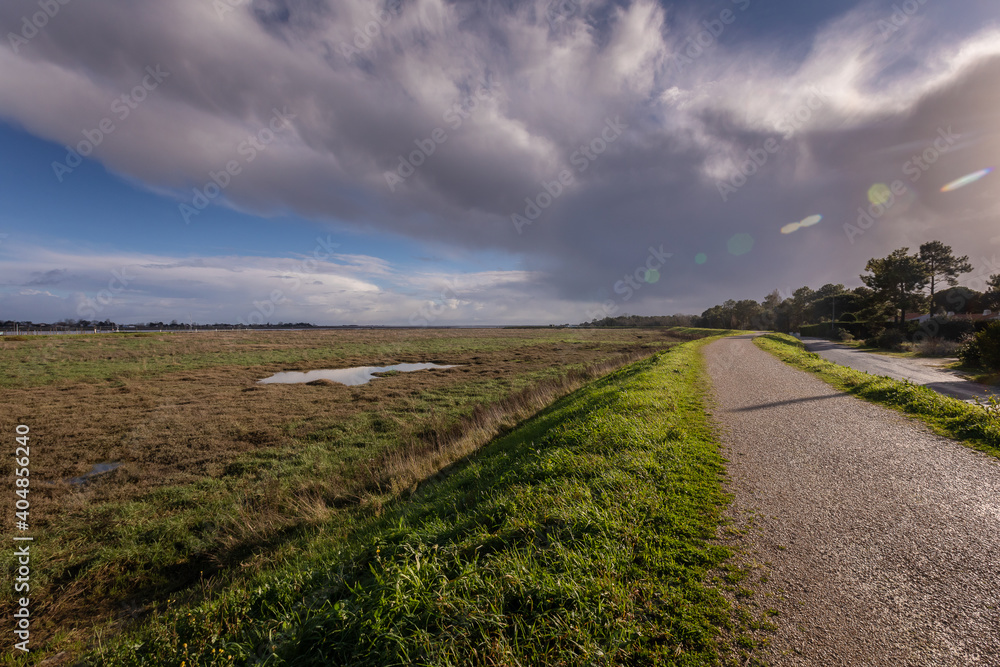 Panoramic view over the wetland, mouth of the Lay river, and the port of l'Aiguillon sur Mer from the dike in la Faute sur Mer, Vendee, France