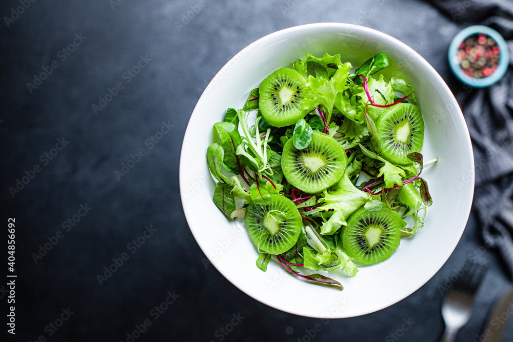 kiwi salad mix lettuce leaves ready to eat on the table healthy meal snack outdoor top view copy space for text food background rustic image - obrazy, fototapety, plakaty 