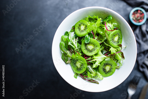 kiwi salad mix lettuce leaves ready to eat on the table healthy meal snack outdoor top view copy space for text food background rustic image