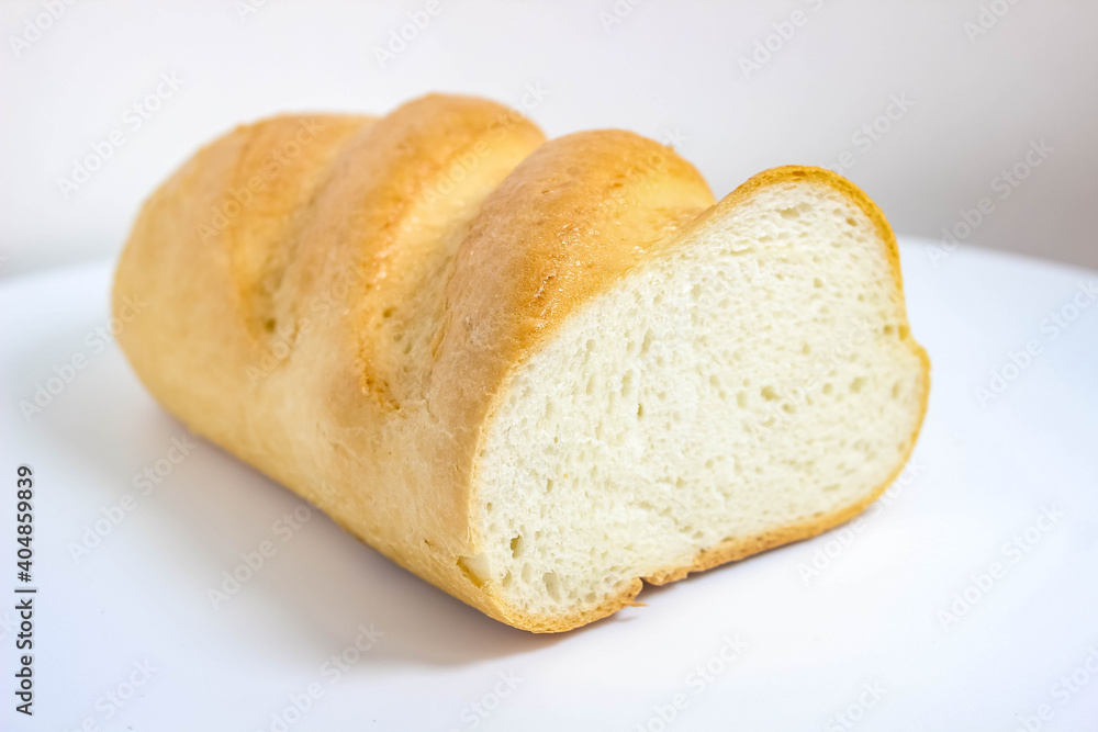 White loaf close-up spinning on a white background. White loaf close-up spinning on a white background.