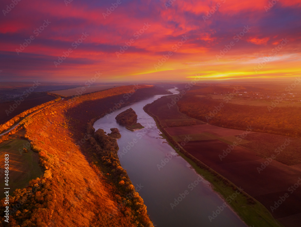 Beautiful top view of winding river in sunset. Scenic image of drone photography.