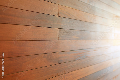 Perspective Brown wood plank wall background with ray of light.