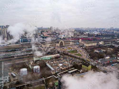 Aerial drone view. The building of the Kiev railway station through the white smoke from the chimneys.