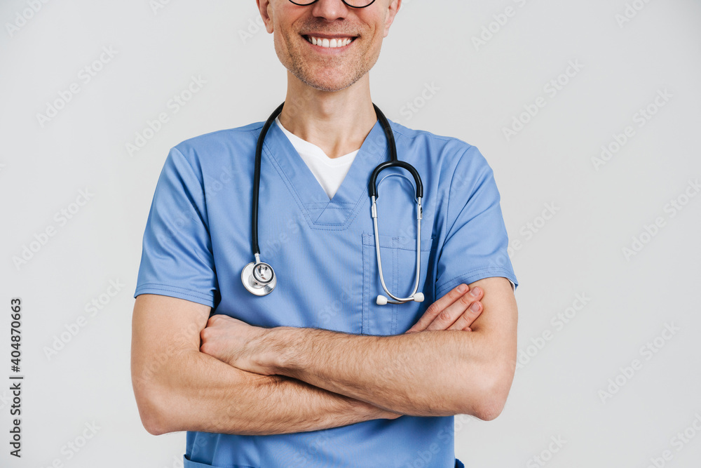 Happy white-haired medical doctor with stethoscope smiling at camera Happy white-haired medical doctor with stethoscope smiling at camera