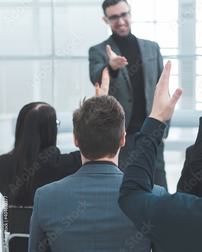 Obraz na płótnie employees ask questions to the speaker during the business seminar. w salonie