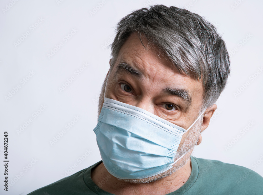 Portrait of man in a protective medical mask. Portrait of man in a protective medical mask.
