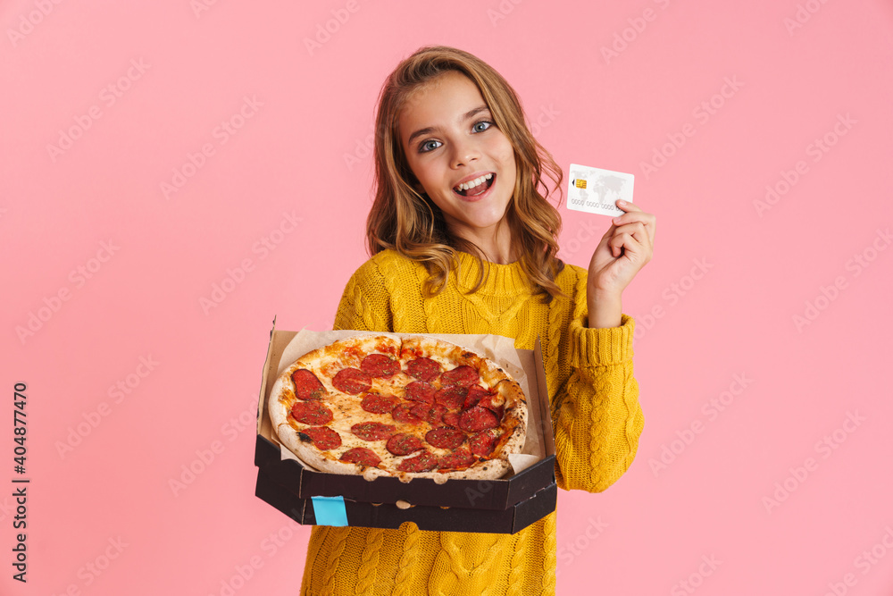 Happy beautiful blonde girl smiling while showing pizza and credit card Happy beautiful blonde girl smiling while showing pizza and credit card