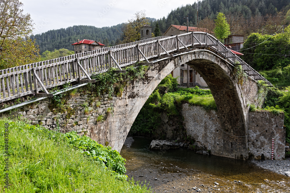 View of the traditional stone bridge of Vovousa in Epirus, Greece