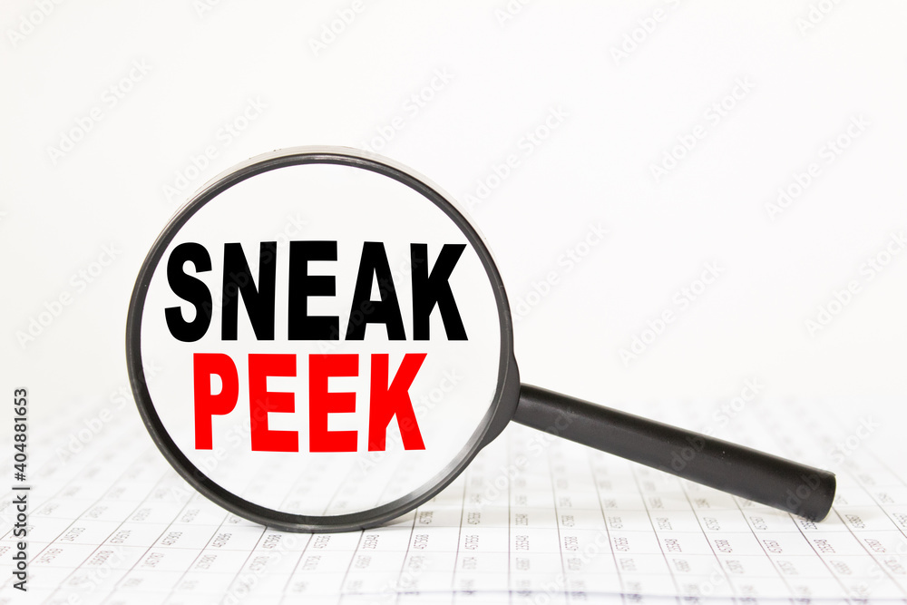 words SNEAK PEEK in a magnifying glass on a white background. business concept words SNEAK PEEK in a magnifying glass on a white background. business concept