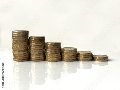 stacks of coins on a white background