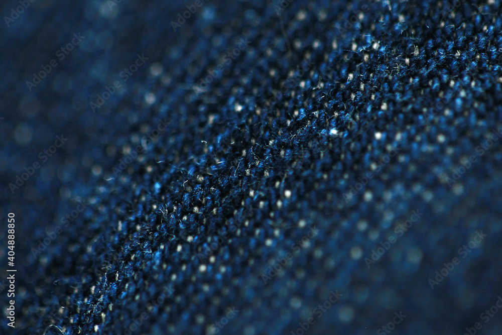 Jeans denim texture close up , focus only one point , soft blured background wallpaper