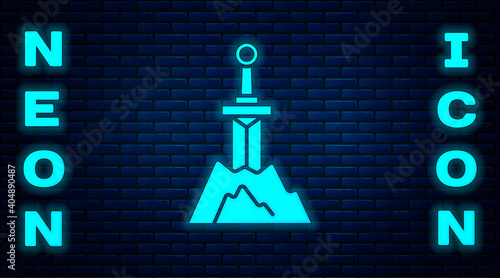 Glowing neon Sword in the stone icon isolated on brick wall background. Excalibur the sword in the stone from the Arthurian legends. Vector.